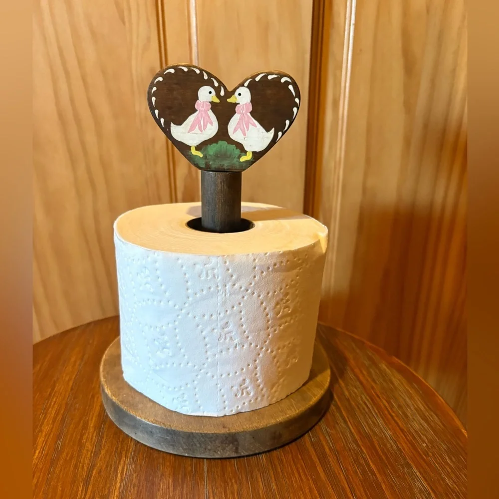Vintage-style handmade wooden toilet tissue holder with painted geese